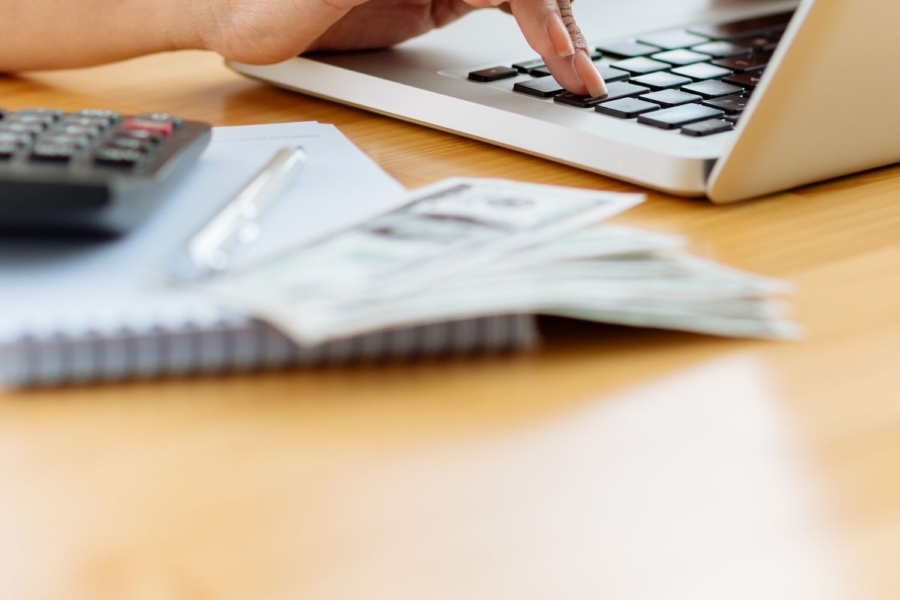 A person looks at utility bills.